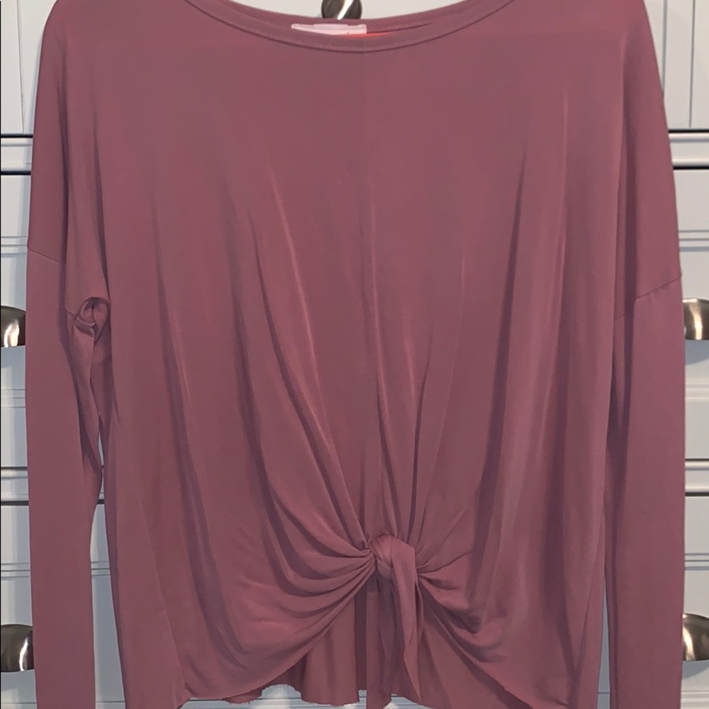 a pink top